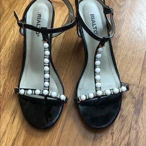 Rialto - Black patent strappy sandal with 2” heel.